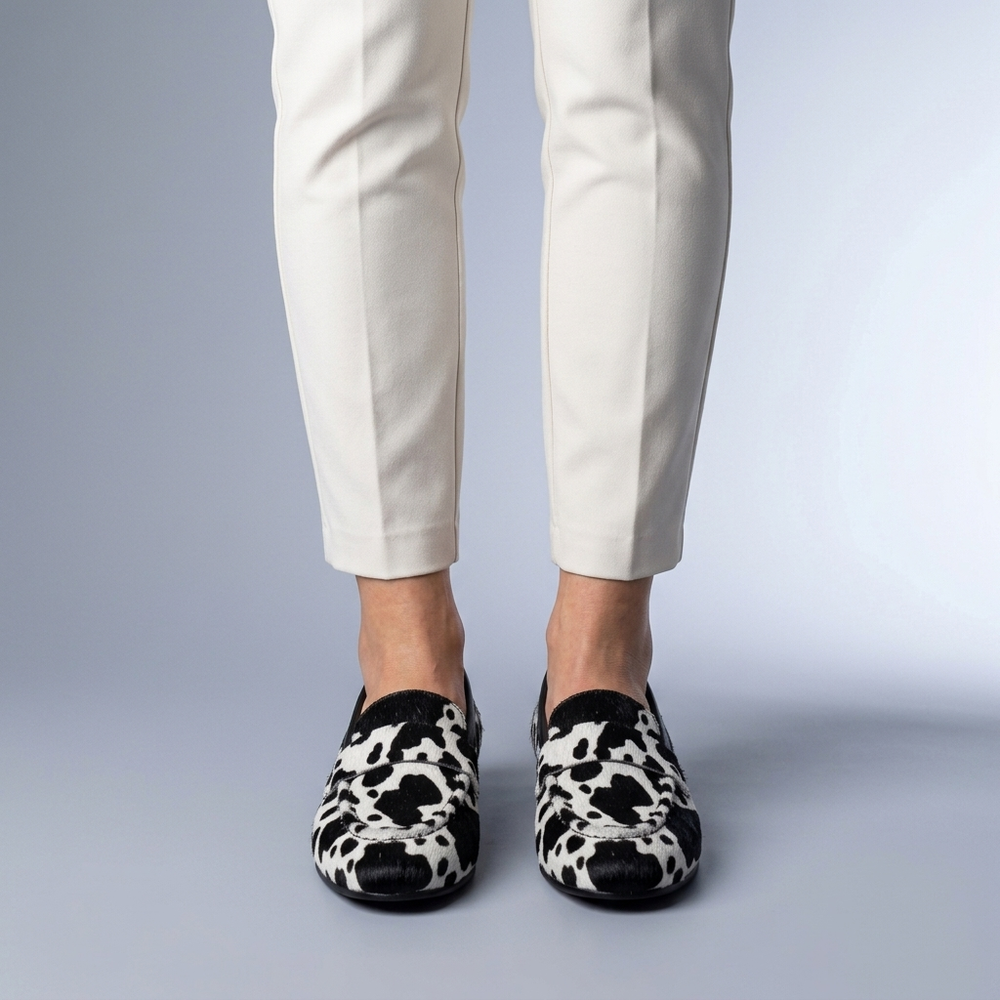 Black Shoes For Women | Slip-On Loafers Cow Print Black and White three-quarter front view