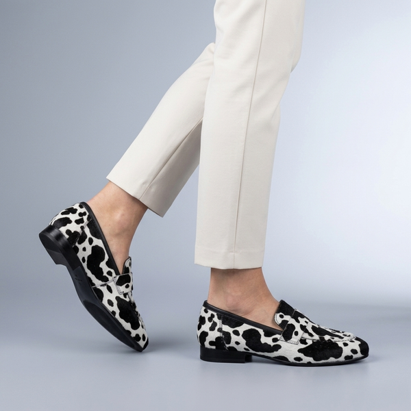 Black Shoes For Women | Slip-On Loafers Cow Print Black and White side view mid-step