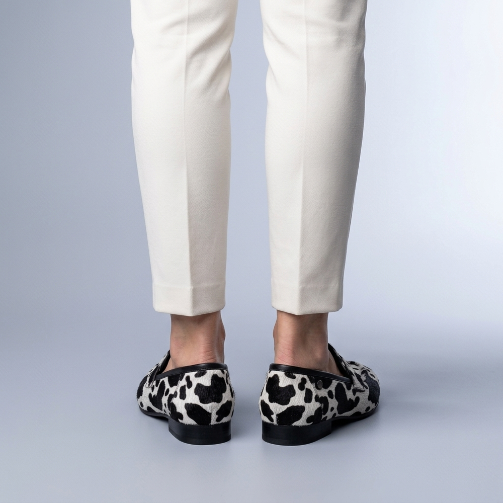 Black Shoes For Women | Slip-On Loafers Cow Print Black and White three-quarter front view