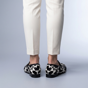 Black Shoes For Women | Slip-On Loafers Cow Print Black and White back view worn